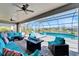 Outdoor living with screened pool, spa, covered patio and comfortable seating area at 9152 Warm Springs Cir, Parrish, FL 34219