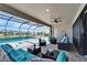 Expansive, screened-in pool and patio area with comfortable seating, perfect for relaxing and entertaining at 9152 Warm Springs Cir, Parrish, FL 34219
