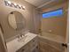 Bright bathroom featuring a bath tub and updated vanity with modern fixtures at 12908 Brant Tree Dr, Riverview, FL 33579