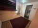 Bedroom with a built-in shelf, neutral walls, and a view into the bathroom at 1319 Vance Rd, Plant City, FL 33566