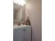 This bathroom vanity has a white cabinet, silver faucet and a towel rack at 1330 70Th N St, St Petersburg, FL 33710