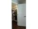 Walk-in closet with clothes hanging on a rod and a shelf on the side at 1330 70Th N St, St Petersburg, FL 33710