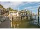 View of a private boat lift area with a walkway and bay access at 238 71St Ave, St Pete Beach, FL 33706