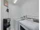 A bright laundry room with a newer washer and dryer plus a convenient water dispenser at 238 71St Ave, St Pete Beach, FL 33706