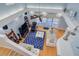Stylish living room with hardwood floors, a plush sofa, and a ceiling fan at 238 71St Ave, St Pete Beach, FL 33706
