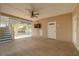 Relaxing outdoor patio with covered seating, tiled floors, and a fan at 238 71St Ave, St Pete Beach, FL 33706