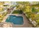 Aerial view of the backyard pool with brick pavers and access to the bay at 238 71St Ave, St Pete Beach, FL 33706
