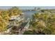 Breathtaking waterfront view featuring boatlifts, docks, and verdant landscaping at 238 71St Ave, St Pete Beach, FL 33706