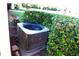 Air conditioner unit located outside of the home surrounded by hedges at 11021 Edge Park Dr, Hudson, FL 34667