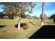 A serene view of a sprawling backyard offering ample space and natural beauty at 11021 Edge Park Dr, Hudson, FL 34667