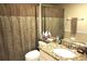 Bathroom features a vanity with a granite countertop and a shower with a shower curtain at 11021 Edge Park Dr, Hudson, FL 34667