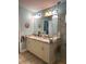 Bathroom with granite countertops, vanity, and updated walk-in shower at 11021 Edge Park Dr, Hudson, FL 34667