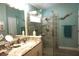 Bathroom features a glass enclosed shower, and a vanity with marble countertop at 11021 Edge Park Dr, Hudson, FL 34667