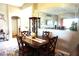 Cozy dining room featuring wood table, chairs, decorative rug and accent wall at 11021 Edge Park Dr, Hudson, FL 34667