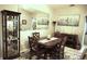Cozy dining area with a decorative cabinet, attractive wood table and decorative mirror at 11021 Edge Park Dr, Hudson, FL 34667