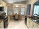 Bright kitchen featuring granite countertops, stainless steel appliances, and eat-in kitchen area at 11021 Edge Park Dr, Hudson, FL 34667