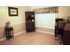 This home office has hardwood floors, a large window, and recessed lighting at 11021 Edge Park Dr, Hudson, FL 34667