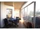This screened patio features a tile floor, a ceiling fan, and a great view of the outdoors at 11021 Edge Park Dr, Hudson, FL 34667