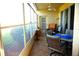 Screened patio with ceiling fan and dining table. Overlooks backyard at 11021 Edge Park Dr, Hudson, FL 34667
