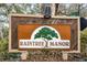 Raintree Manor community sign. The sign features a tree logo and brown and beige accents at 11805 Northtrail Ave, Temple Terrace, FL 33617