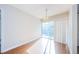 Bright dining room featuring wood floors, sliding glass doors and contemporary chandelier at 11805 Northtrail Ave, Temple Terrace, FL 33617