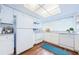 Bright, all-white kitchen with white appliances, lots of counter space and light at 11805 Northtrail Ave, Temple Terrace, FL 33617