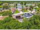 Aerial view of homes in community with lake view at 15815 Muirfield Dr, Odessa, FL 33556