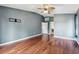 Spacious bedroom with wood flooring and a ceiling fan at 15815 Muirfield Dr, Odessa, FL 33556