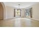 Well-lit dining room with tiled flooring and ample natural light from large windows at 15815 Muirfield Dr, Odessa, FL 33556