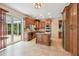 Modern kitchen featuring stainless steel appliances, an island, and ample cabinet space at 15815 Muirfield Dr, Odessa, FL 33556
