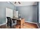 Charming office space with wood floors, a ceiling fan, and blue walls at 15815 Muirfield Dr, Odessa, FL 33556