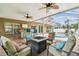 Spacious screened patio featuring a built-in grill area, ample seating, and pool views at 15815 Muirfield Dr, Odessa, FL 33556