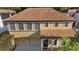 This aerial view highlights the home's tile roof at 20314 Chestnut Grove Dr, Tampa, FL 33647