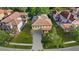 Aerial view showing the clay tile roof, well-maintained lawn, and neighborhood layout at 20314 Chestnut Grove Dr, Tampa, FL 33647