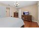 Bedroom featuring a TV and luxurious furniture at 20314 Chestnut Grove Dr, Tampa, FL 33647
