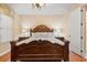 Luxurious bedroom featuring a large, ornate bed at 20314 Chestnut Grove Dr, Tampa, FL 33647