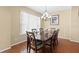 Charming dining room with a classic chandelier and a large window for natural light at 20314 Chestnut Grove Dr, Tampa, FL 33647