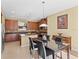 Dining room featuring adjacent kitchen with modern appliances and tiled flooring at 20314 Chestnut Grove Dr, Tampa, FL 33647