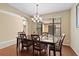 Bright dining room with chandelier and backyard access at 20314 Chestnut Grove Dr, Tampa, FL 33647