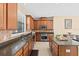 Charming kitchen with stainless appliances, a large window, and spacious countertops at 20314 Chestnut Grove Dr, Tampa, FL 33647