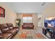 Comfortable living room with multiple seating options and a fireplace at 20314 Chestnut Grove Dr, Tampa, FL 33647