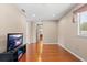 Relaxing living room with wood flooring and a TV at 20314 Chestnut Grove Dr, Tampa, FL 33647