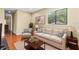 Cozy living room with hardwood floors, neutral furniture, and a bright window view at 20314 Chestnut Grove Dr, Tampa, FL 33647