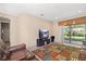 Cozy living room with plush leather seating and outdoor access at 20314 Chestnut Grove Dr, Tampa, FL 33647