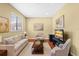 Cozy living room with comfortable seating, natural light, wood floors and a large rug at 20314 Chestnut Grove Dr, Tampa, FL 33647