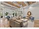 Inviting lounge area with plush seating, wood floors, stylish decor, and access to outdoor amenities at 20314 Chestnut Grove Dr, Tampa, FL 33647