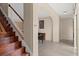 Traditional staircase with wood steps and white railing, leading to an upper level at 20314 Chestnut Grove Dr, Tampa, FL 33647