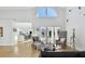 Bright living room featuring soaring ceilings, stylish seating, natural light, and views of the outdoor living space at 21 Crescent S Pl, St Petersburg, FL 33711