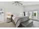 Spacious main bedroom with natural light, a ceiling fan, and access to an outdoor balcony at 21 Crescent S Pl, St Petersburg, FL 33711