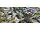 Property view from above with street access, mature trees, and neighborhood buildings at 3102 57Th S St, Gulfport, FL 33707